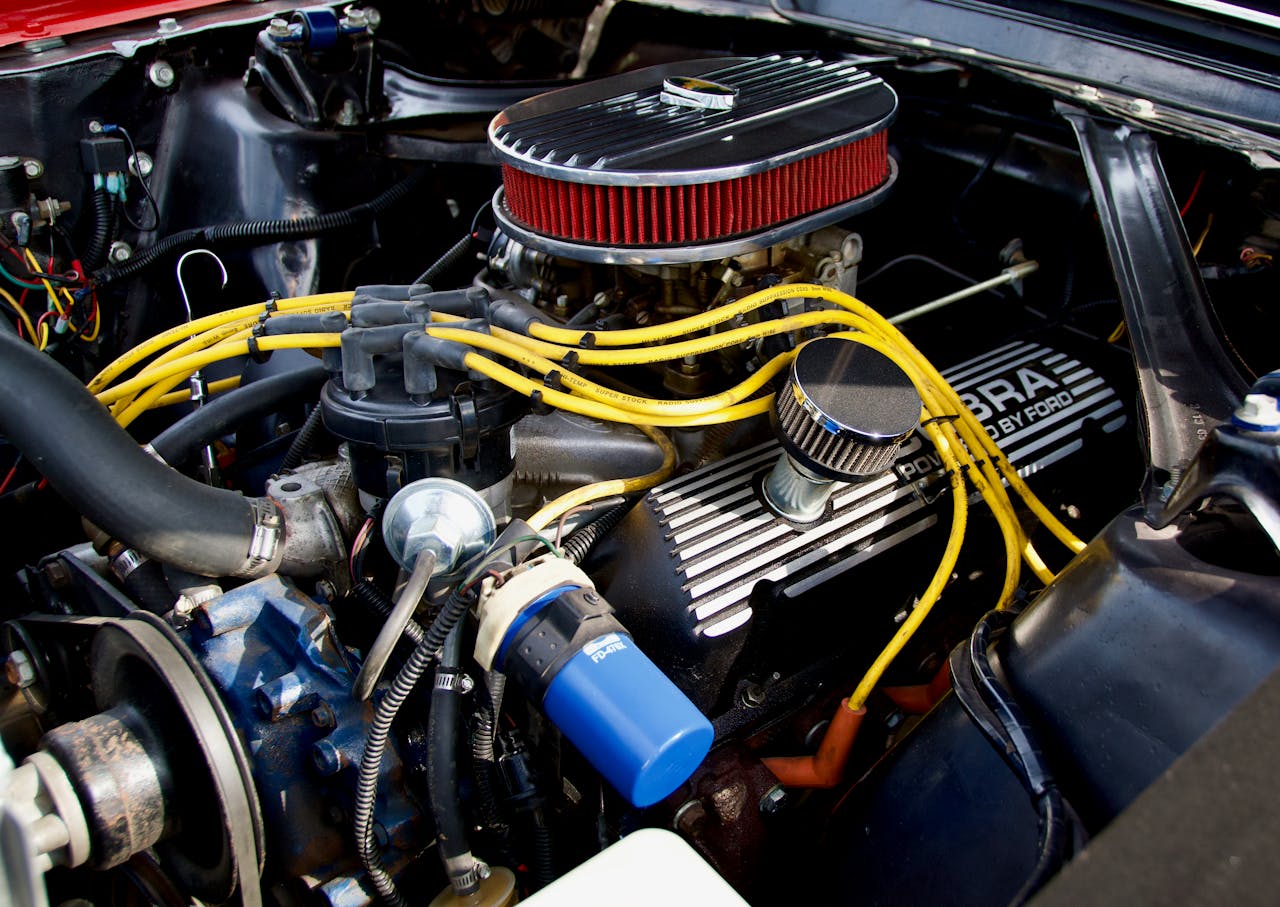 Detailed close-up of a Ford engine showcasing components and vibrant wiring.
